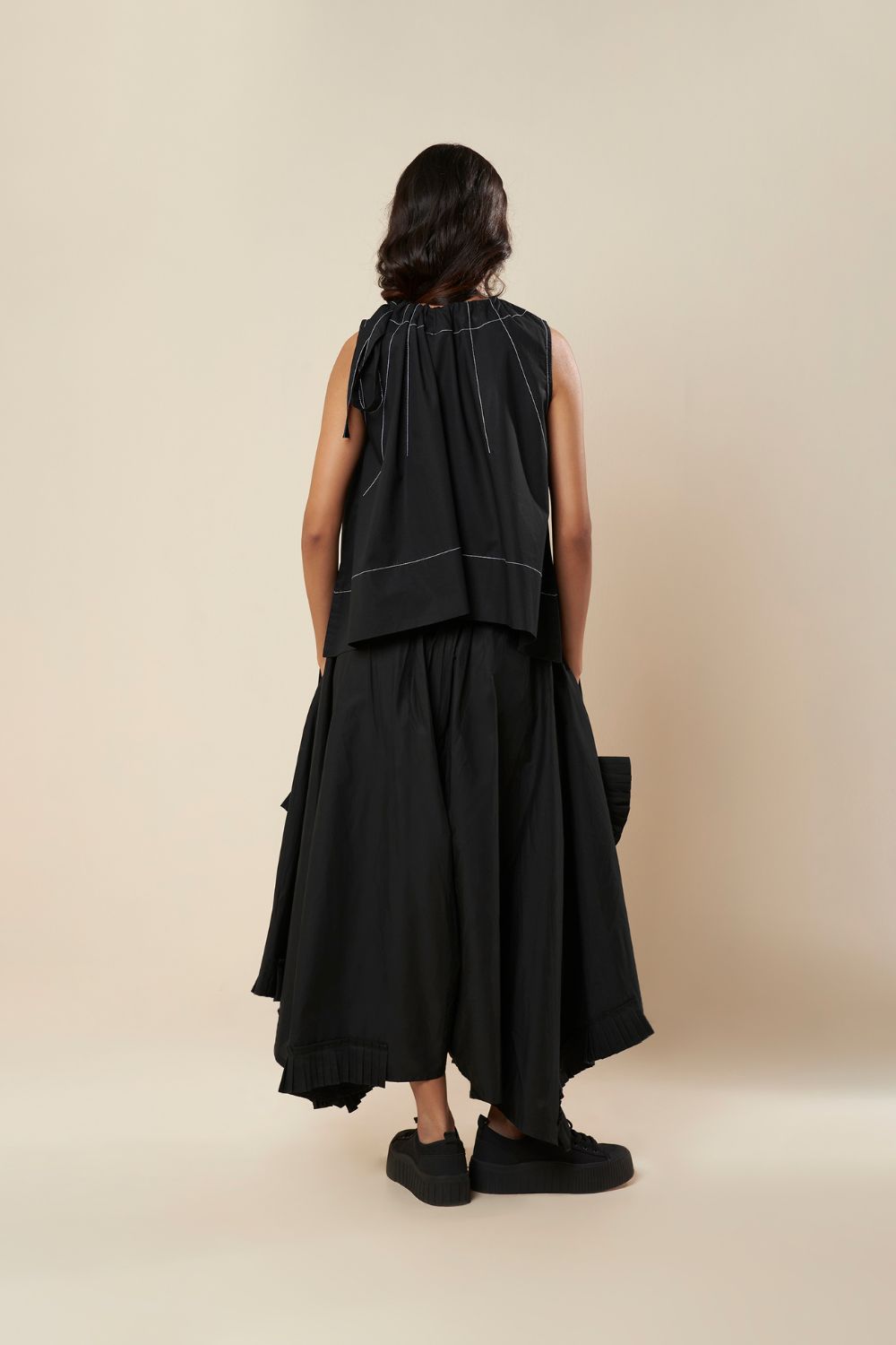 LOW CROTCH PANTS WITH ASYMMETRICAL FRILL PANELS