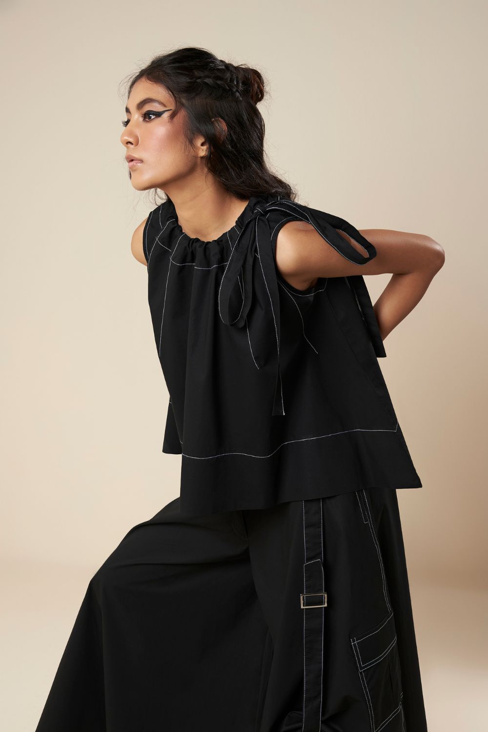 SLEEVELESS FLARE TOP WITH CONTRAST STITCH AND SIDE TIE
