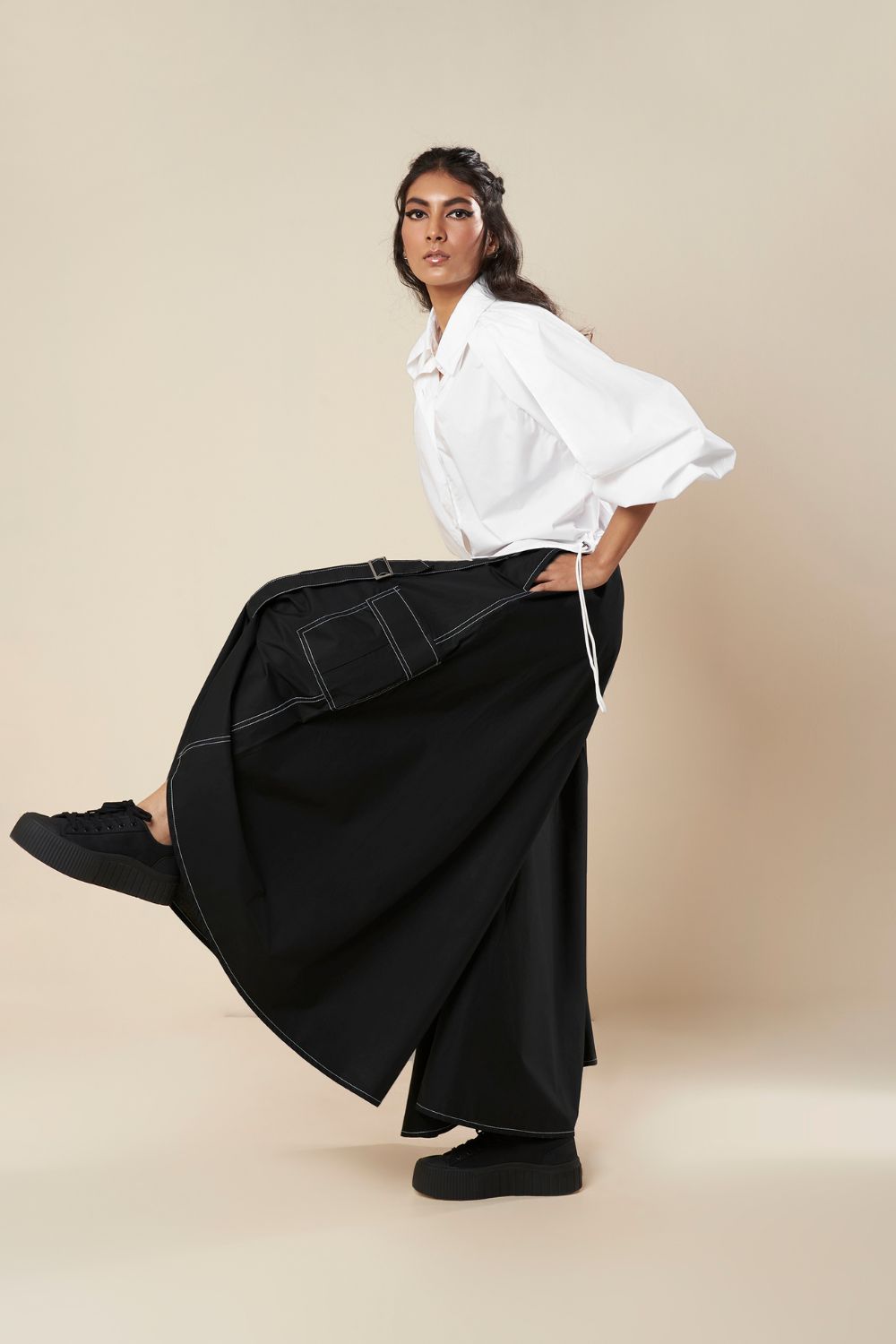 SHIRT WITH EXAGGERATED PLEATED SLEEVE AND ROUCHED HEM