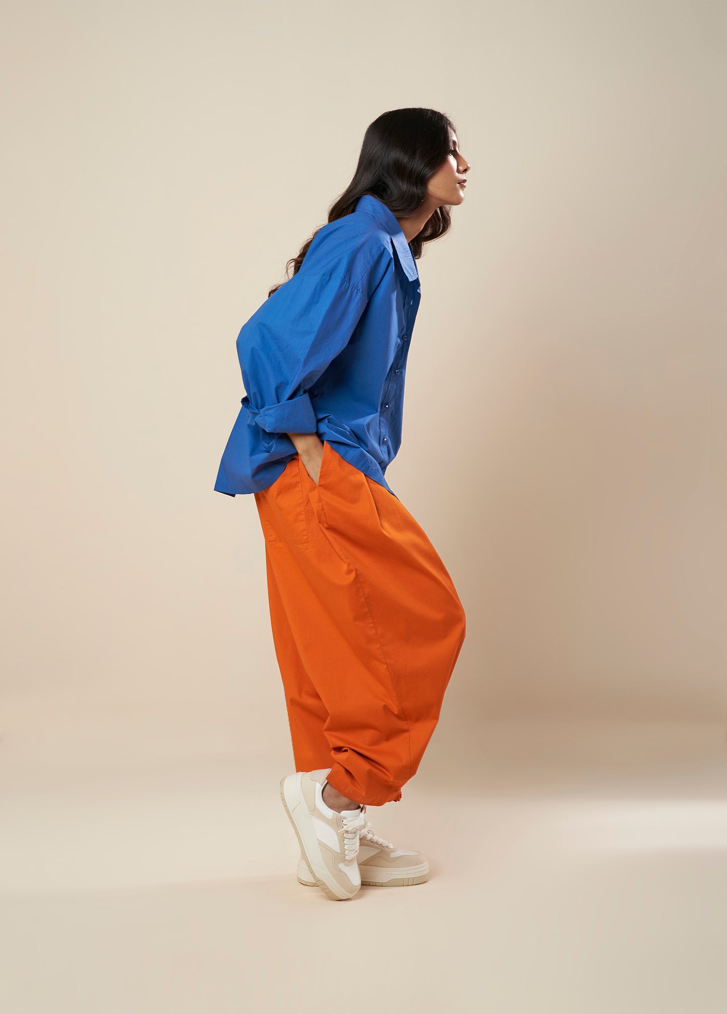 PANTS WITH FRONT PLEAT AND BUTTON HEM