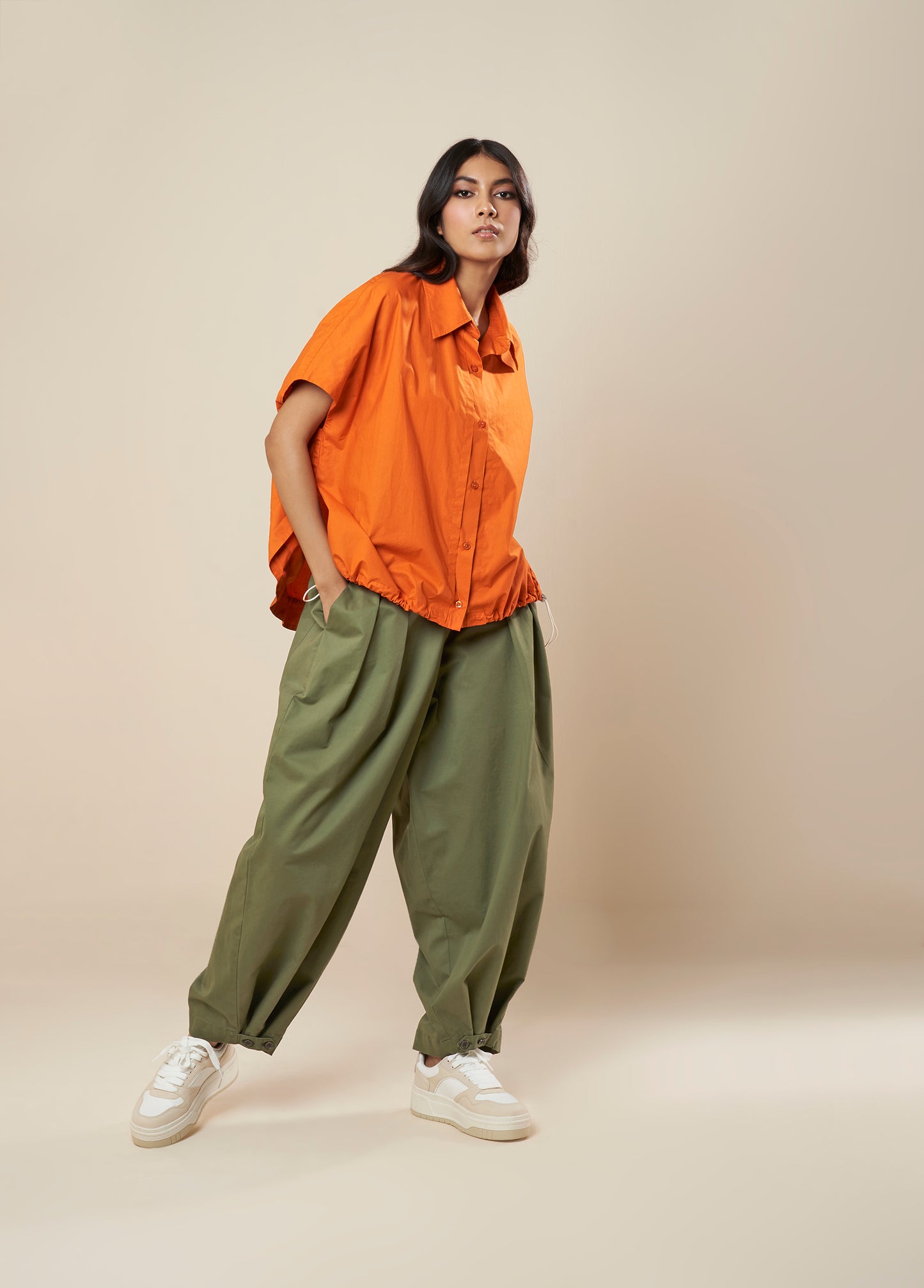 PANTS WITH FRONT PLEAT AND BUTTON HEM