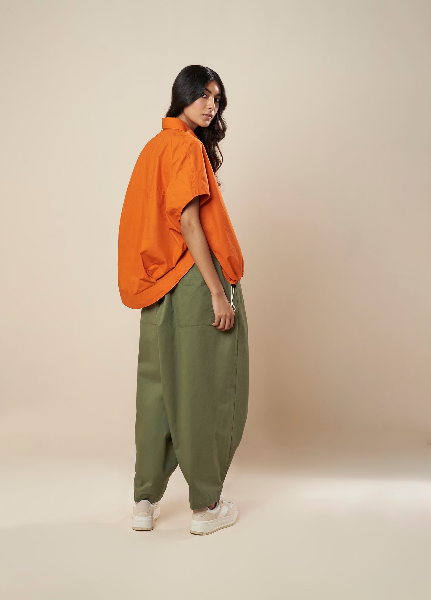 PANTS WITH FRONT PLEAT AND BUTTON HEM