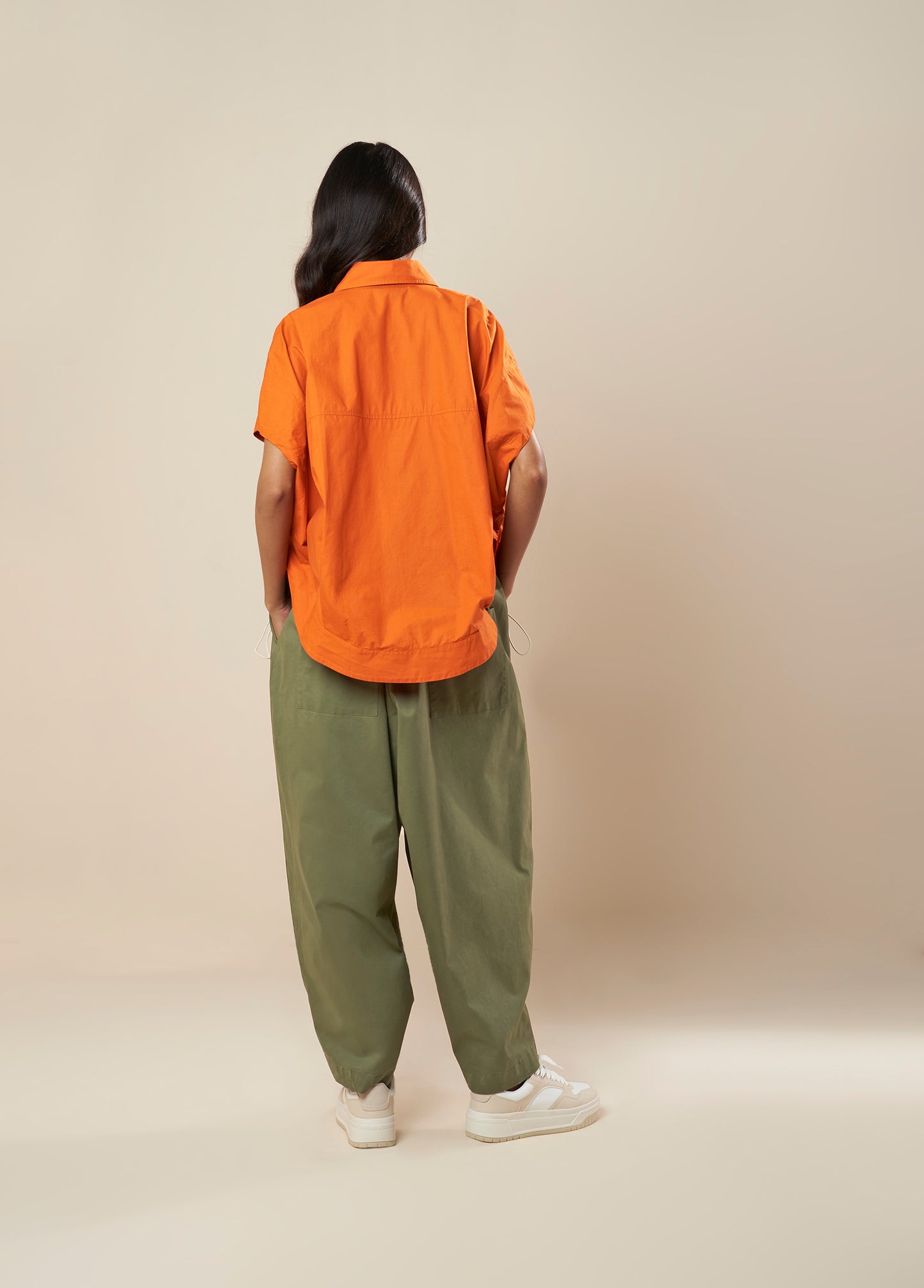 PANTS WITH FRONT PLEAT AND BUTTON HEM