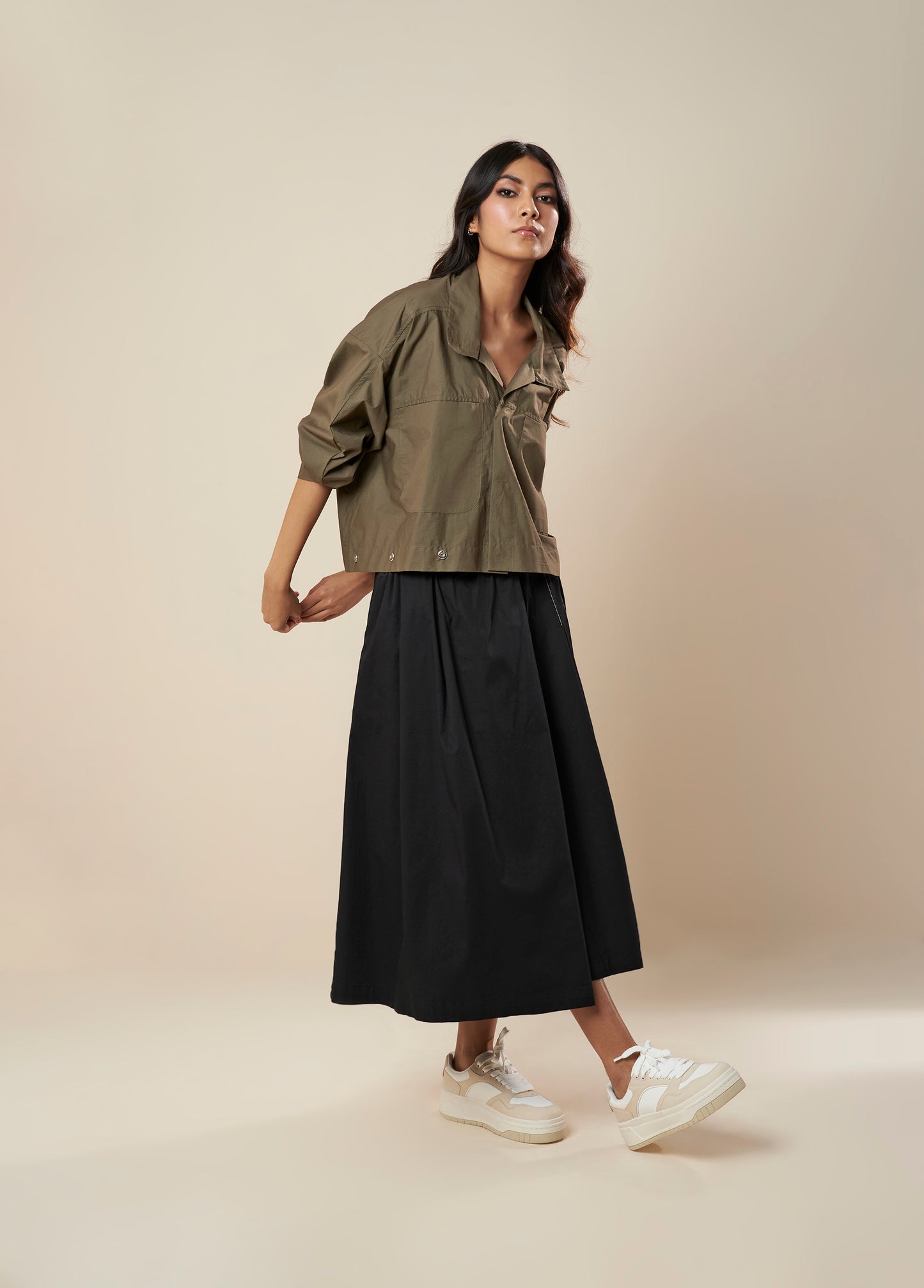 SKIRT WITH PLEATS AND PANELLED HEM
