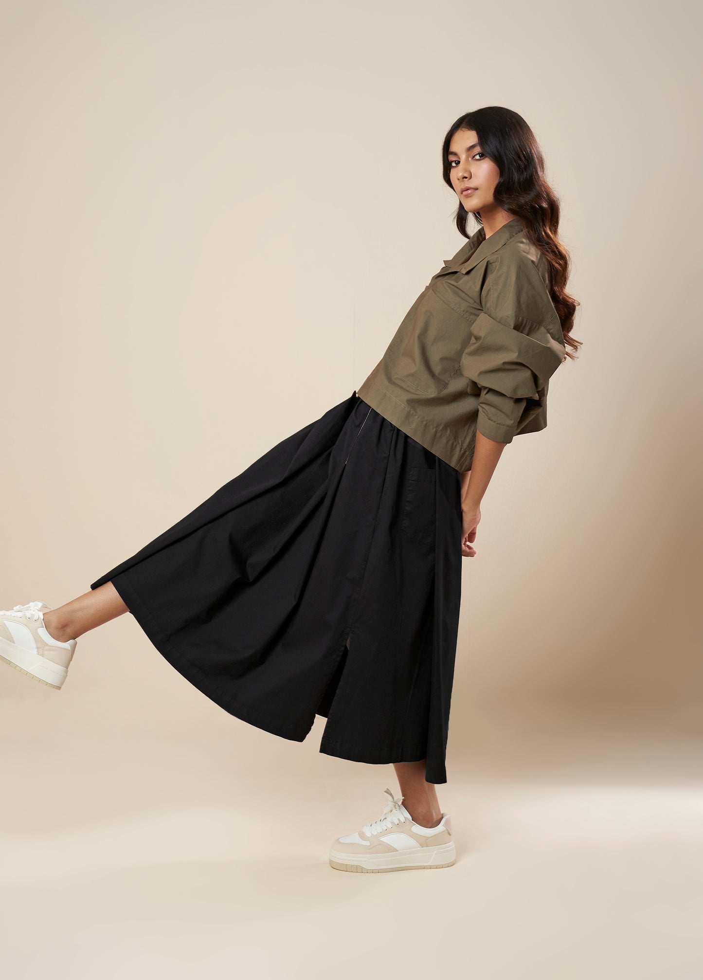 SKIRT WITH PLEATS AND PANELLED HEM