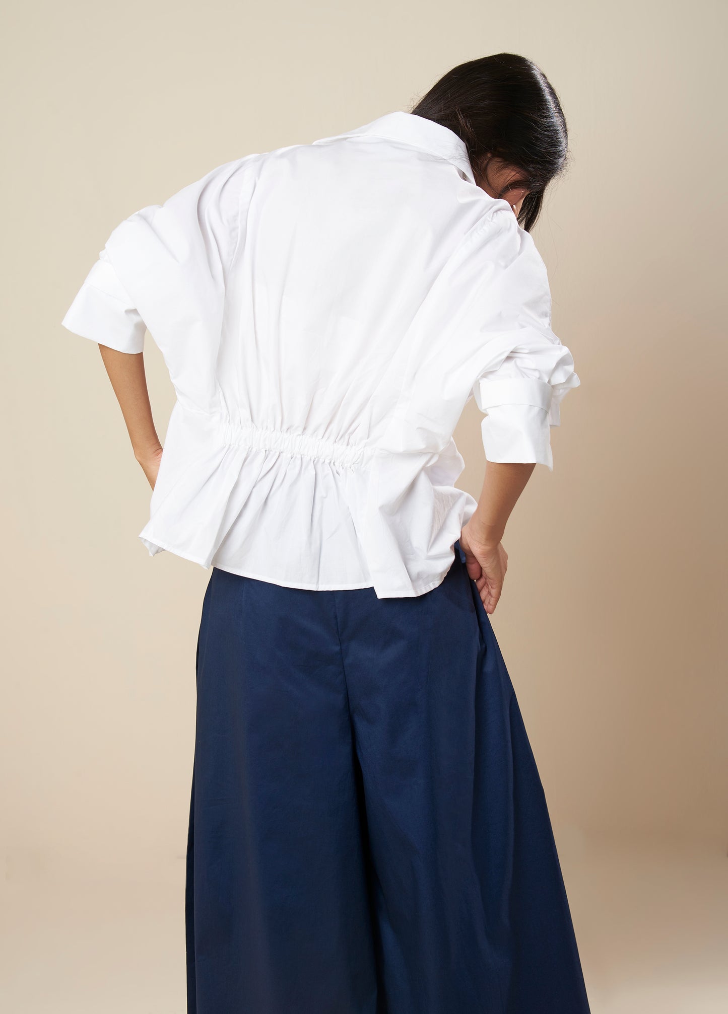 TOP V NECK WITH FRONT PLEAT PANEL AND ELASTIC BACK