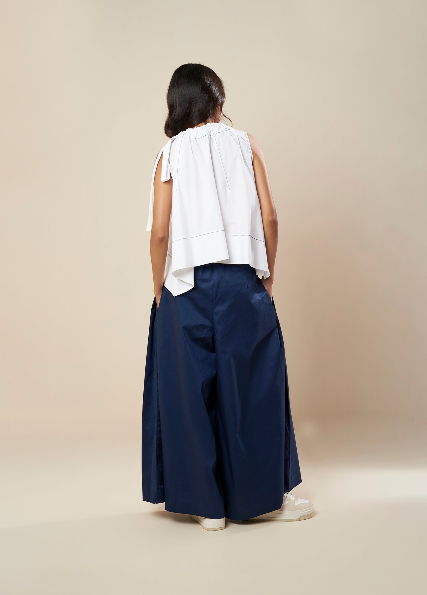 SLEEVELESS FLARE TOP WITH CONTRAST STITCH AND SIDE TIE