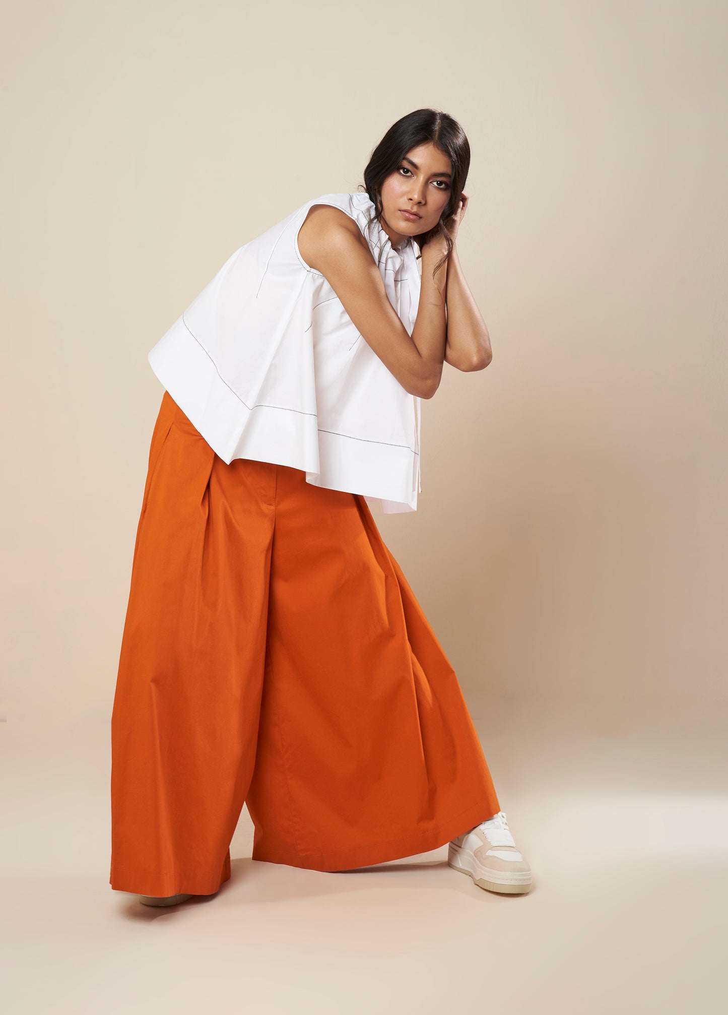 SLEEVELESS FLARE TOP WITH CONTRAST STITCH AND SIDE TIE