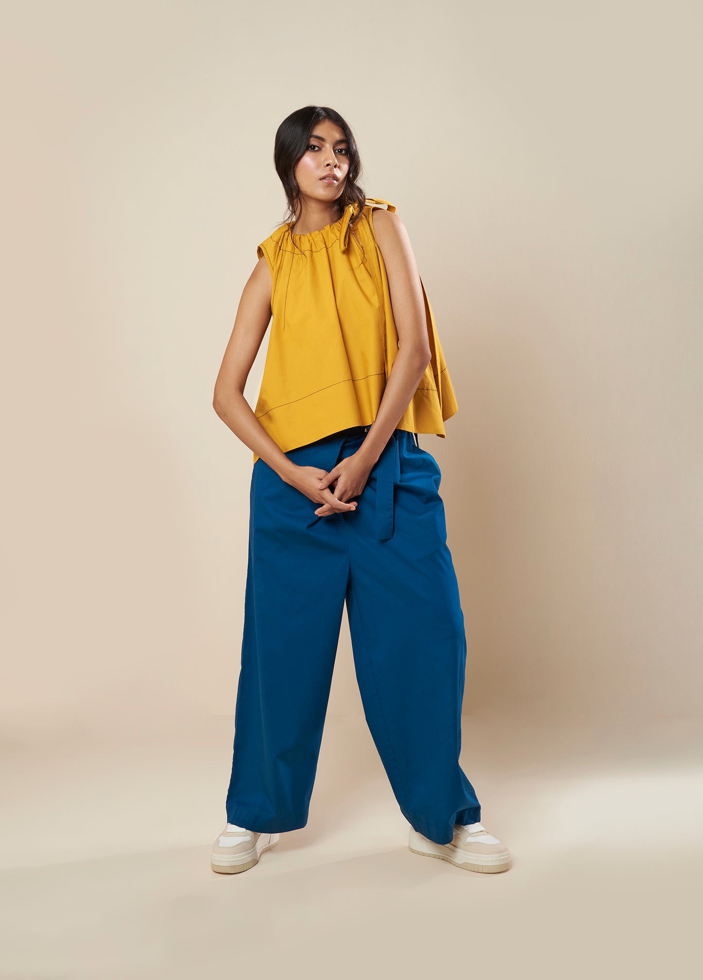 SLEEVELESS FLARE TOP WITH CONTRAST STITCH AND SIDE TIE