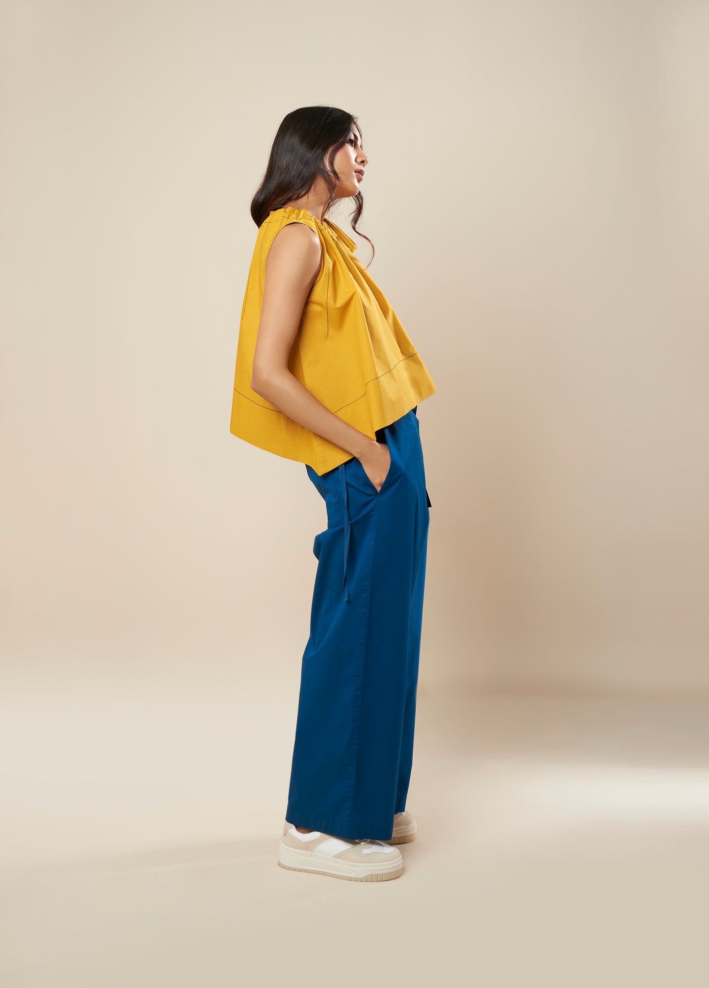 SLEEVELESS FLARE TOP WITH CONTRAST STITCH AND SIDE TIE