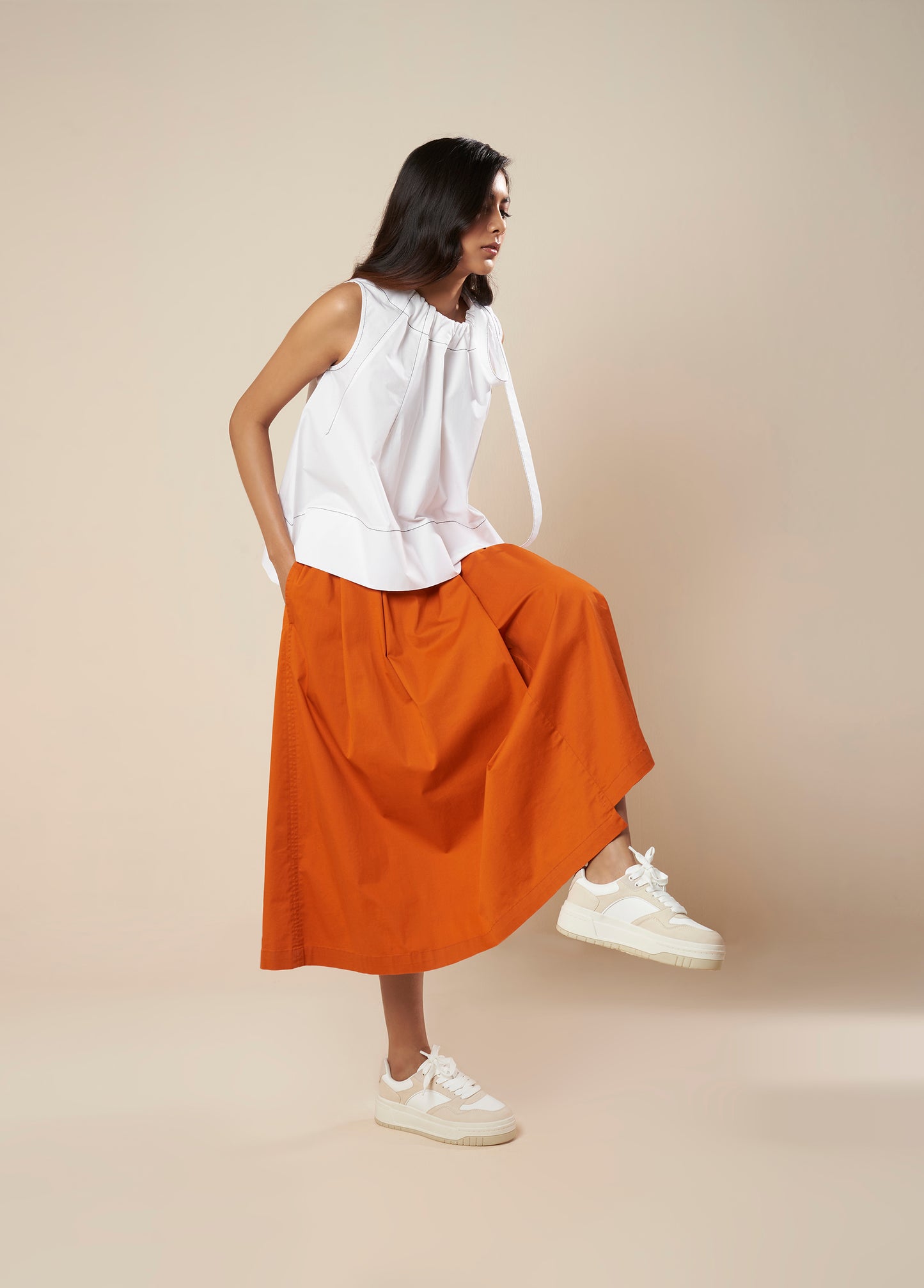 SKIRT WITH PLEATS AND PANELLED HEM