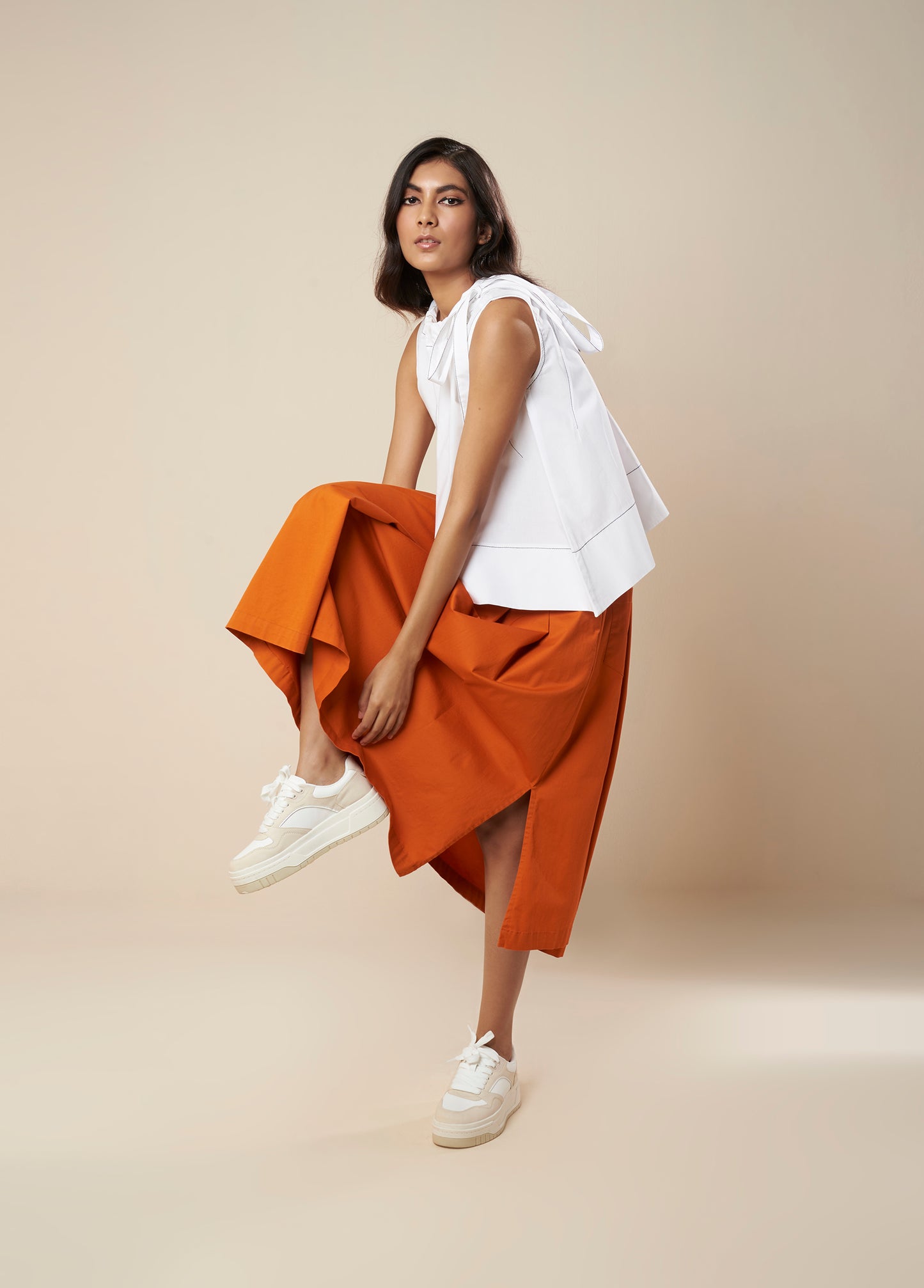 SKIRT WITH PLEATS AND PANELLED HEM
