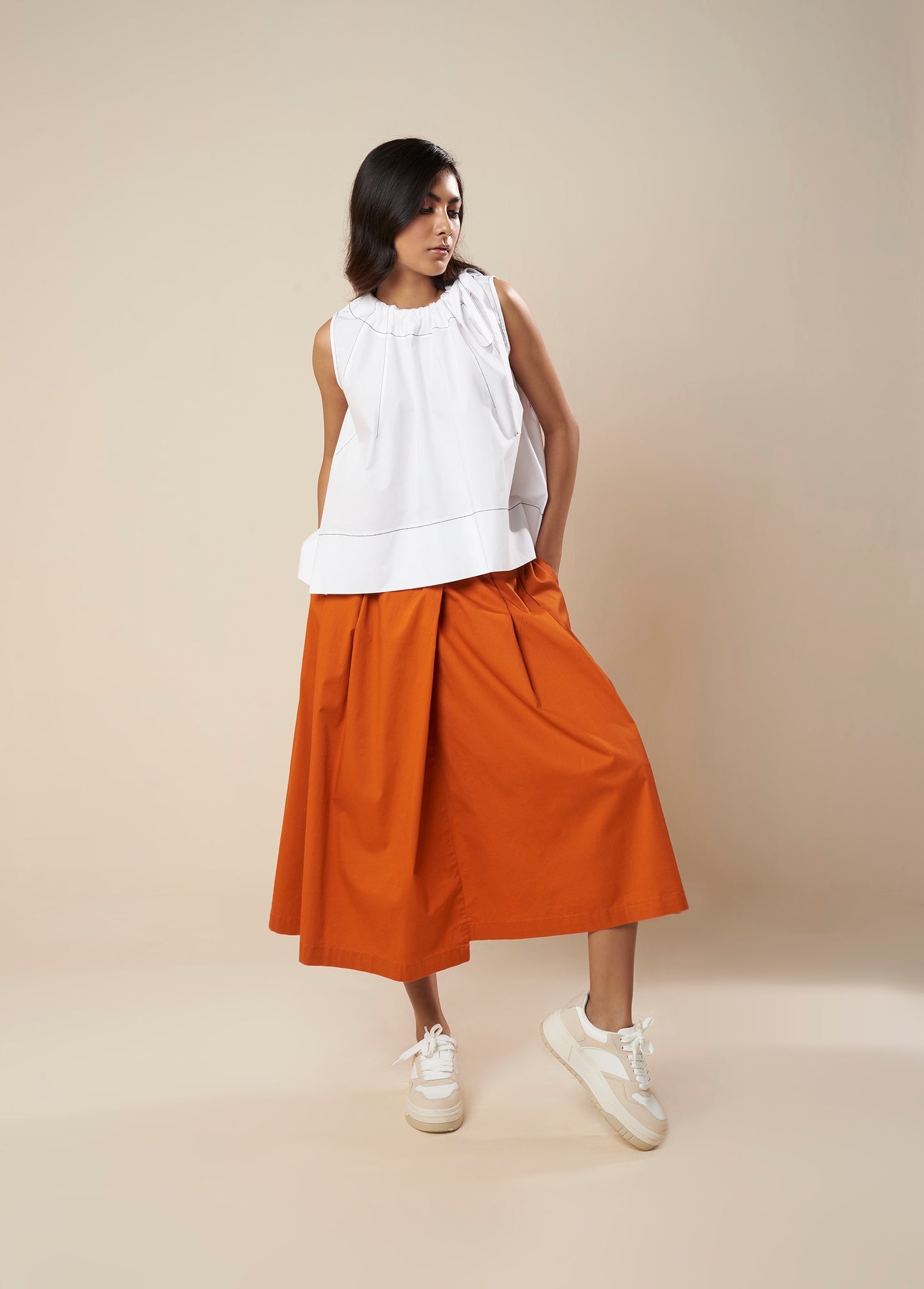 SKIRT WITH PLEATS AND PANELLED HEM