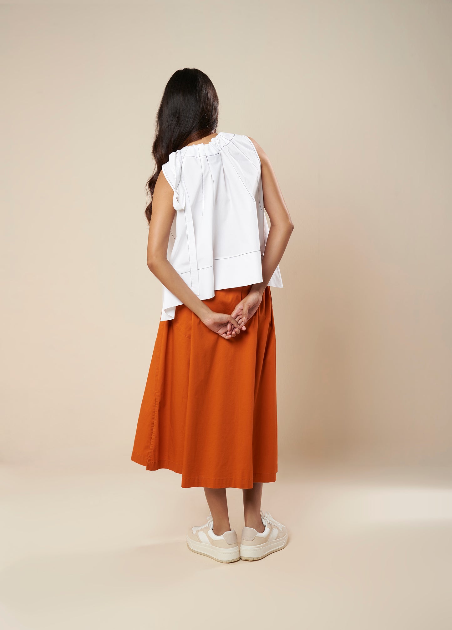 SKIRT WITH PLEATS AND PANELLED HEM