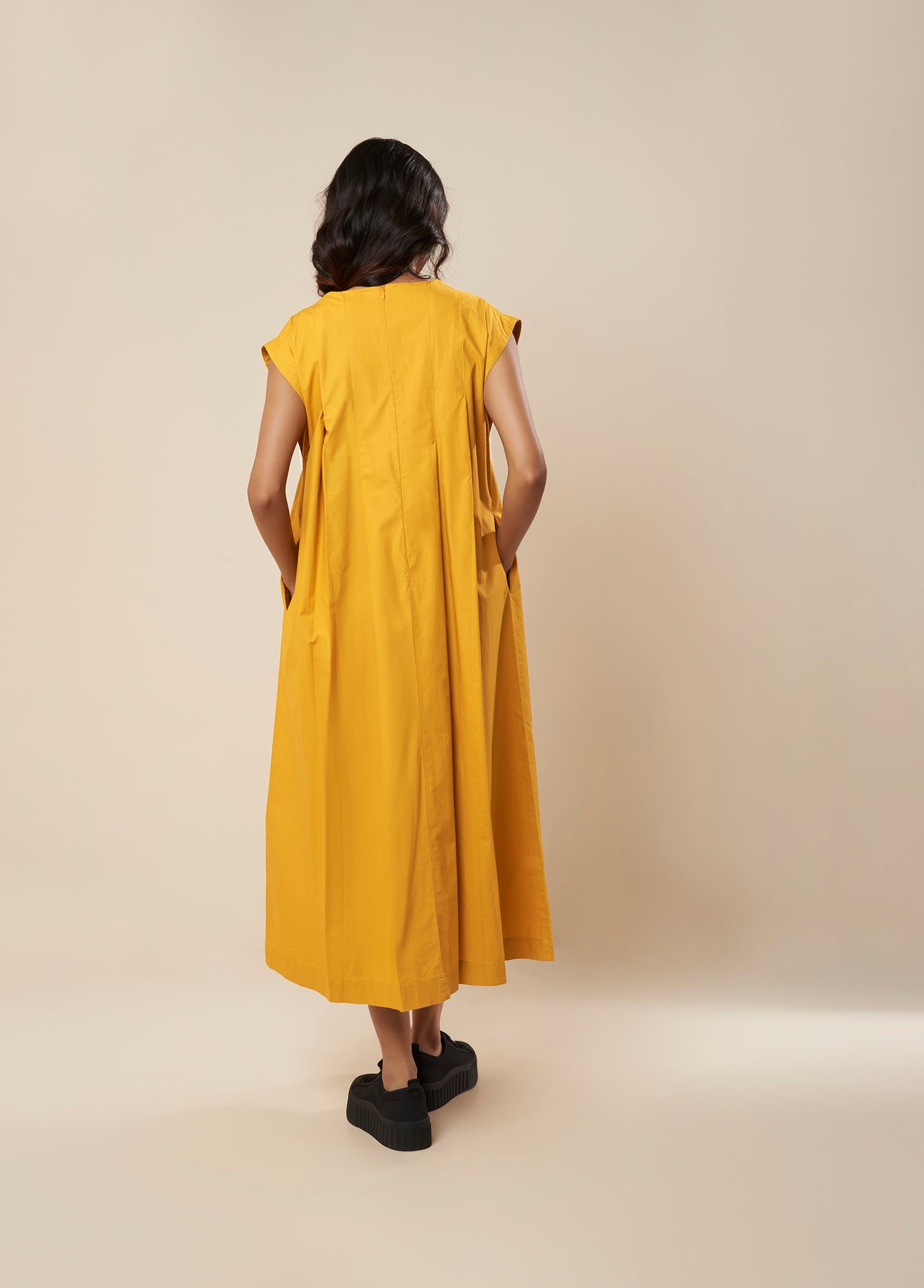 SLEEVELESSS PANEL DRESS WITH PLEATED FRONT