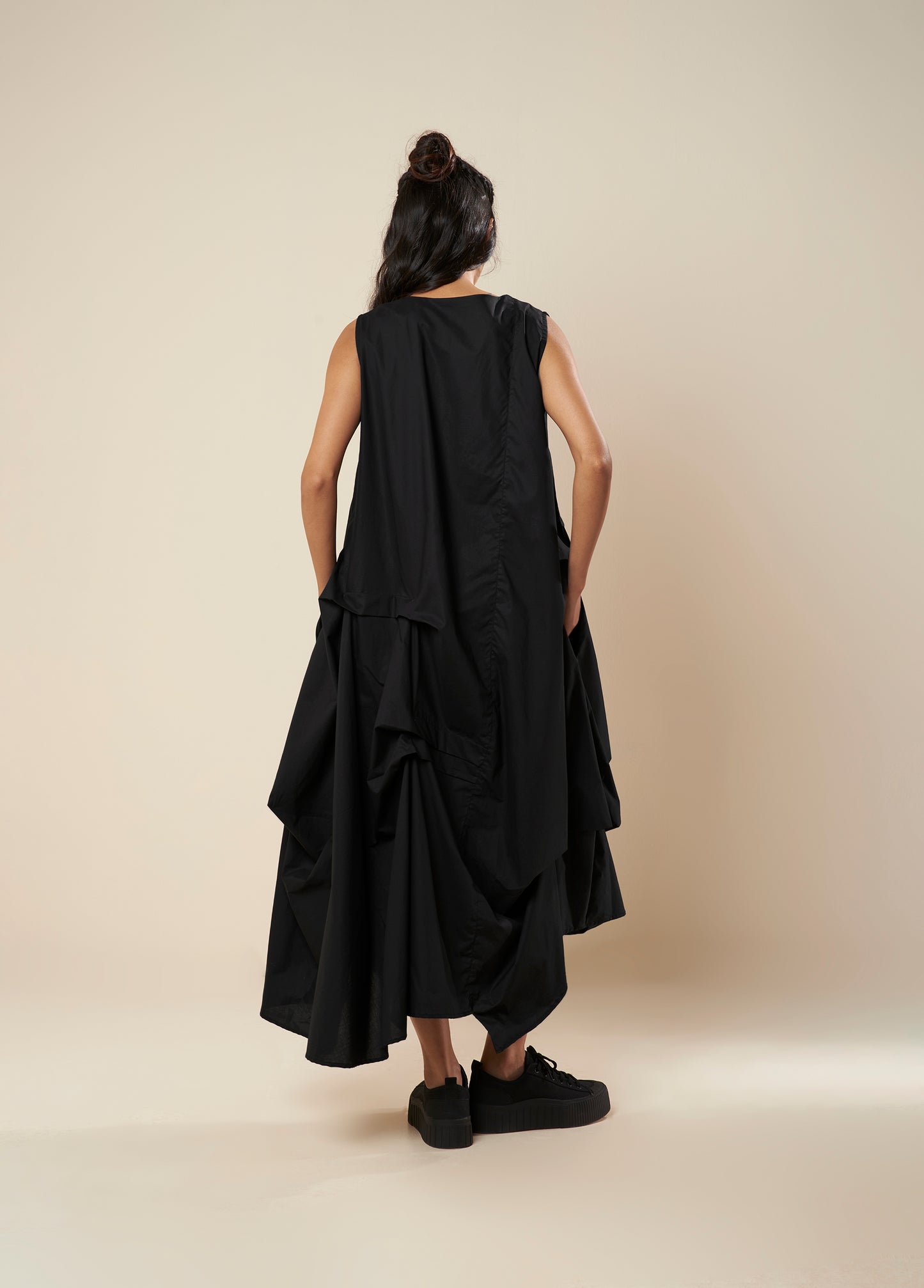 DRESS WITH DRAPE HEM AND STRAP DETAIL