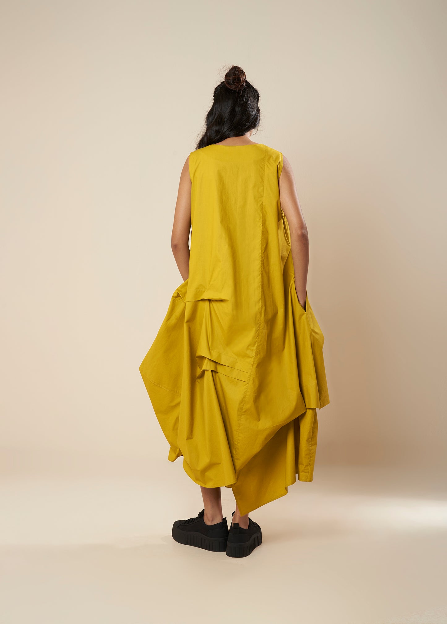 DRESS WITH DRAPE HEM AND STRAP DETAIL