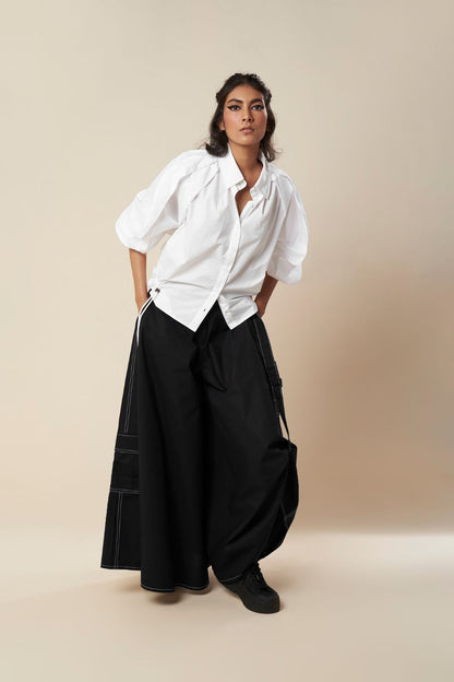 SHIRT WITH EXAGGERATED PLEATED SLEEVE AND ROUCHED HEM