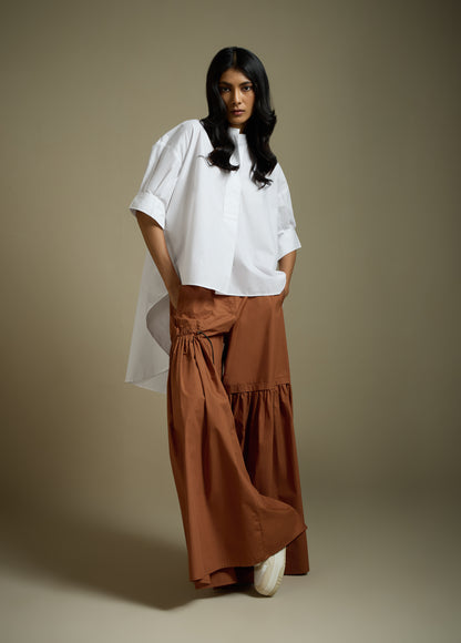 HIGH-LO TOP WITH FLARE AND PLEATED SLEEVE