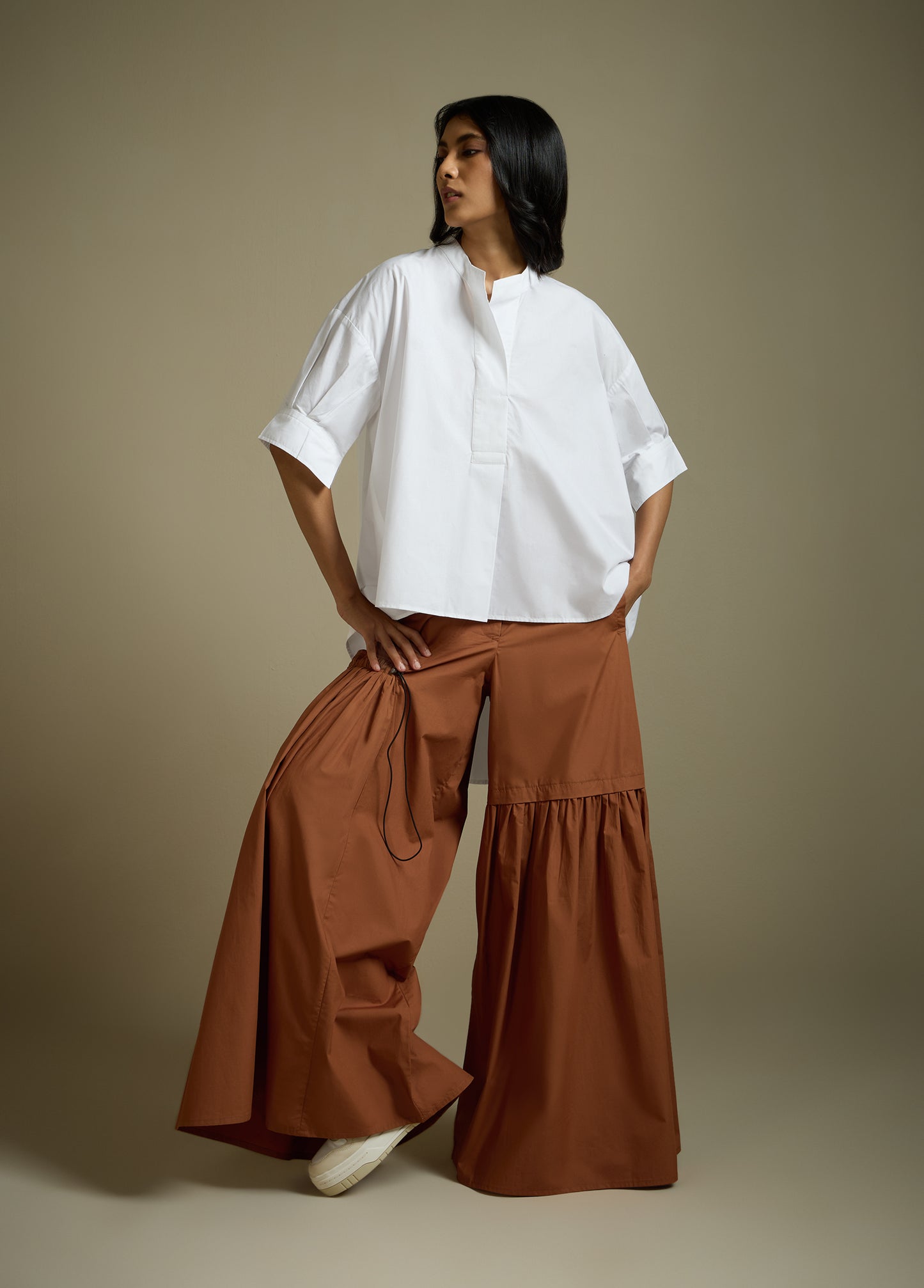 HIGH-LO TOP WITH FLARE AND PLEATED SLEEVE