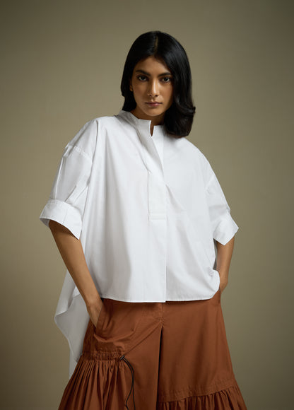 HIGH-LO TOP WITH FLARE AND PLEATED SLEEVE