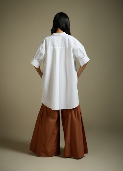 HIGH-LO TOP WITH FLARE AND PLEATED SLEEVE