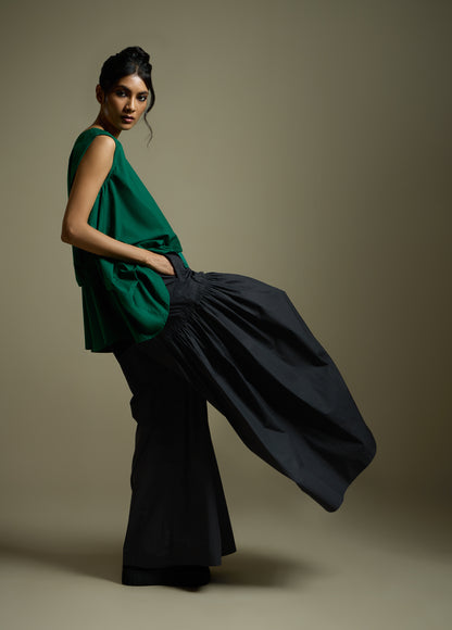 SLEEVELESS TOP WITH PANELLED DRAPE HEM