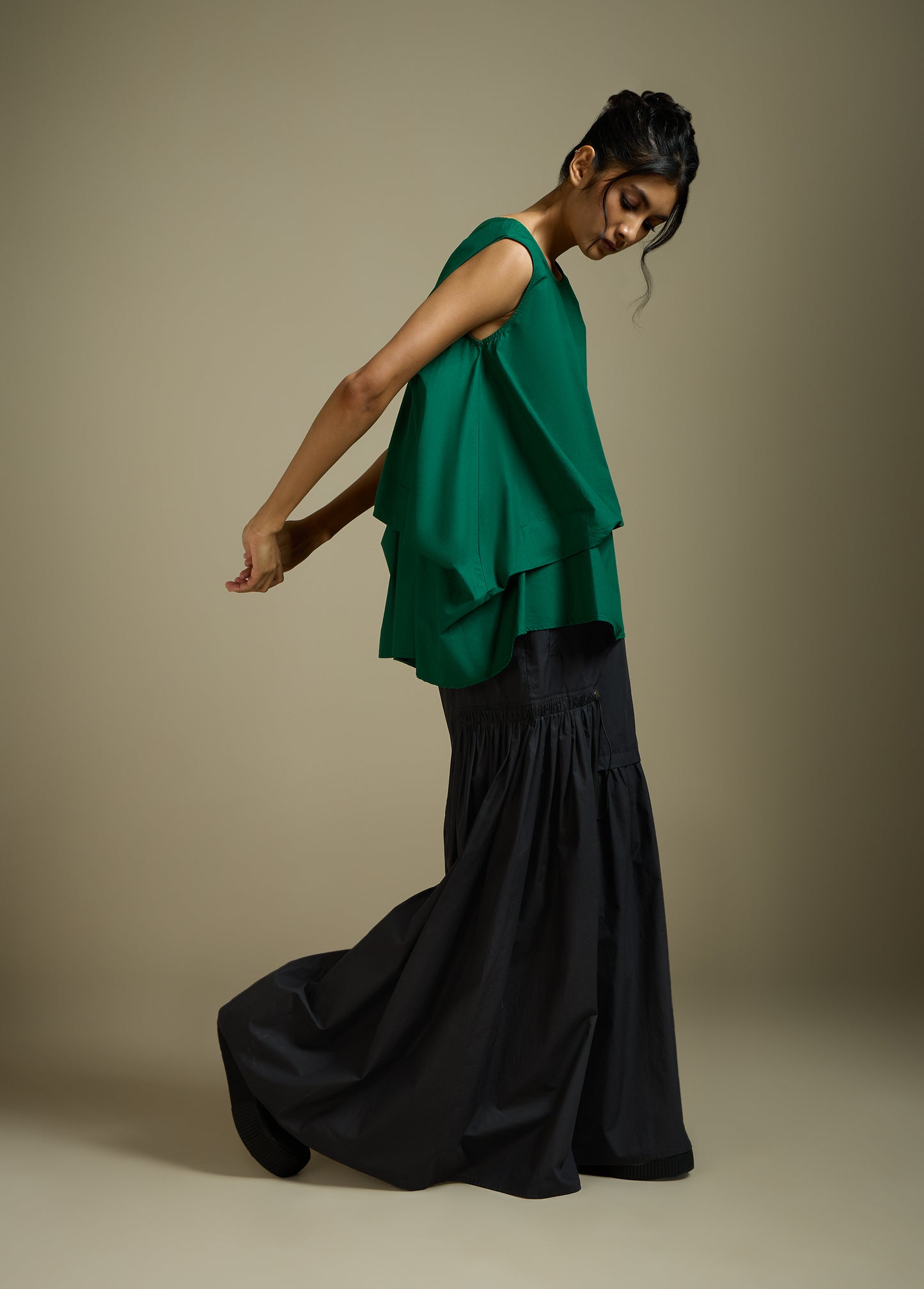 SLEEVELESS TOP WITH PANELLED DRAPE HEM