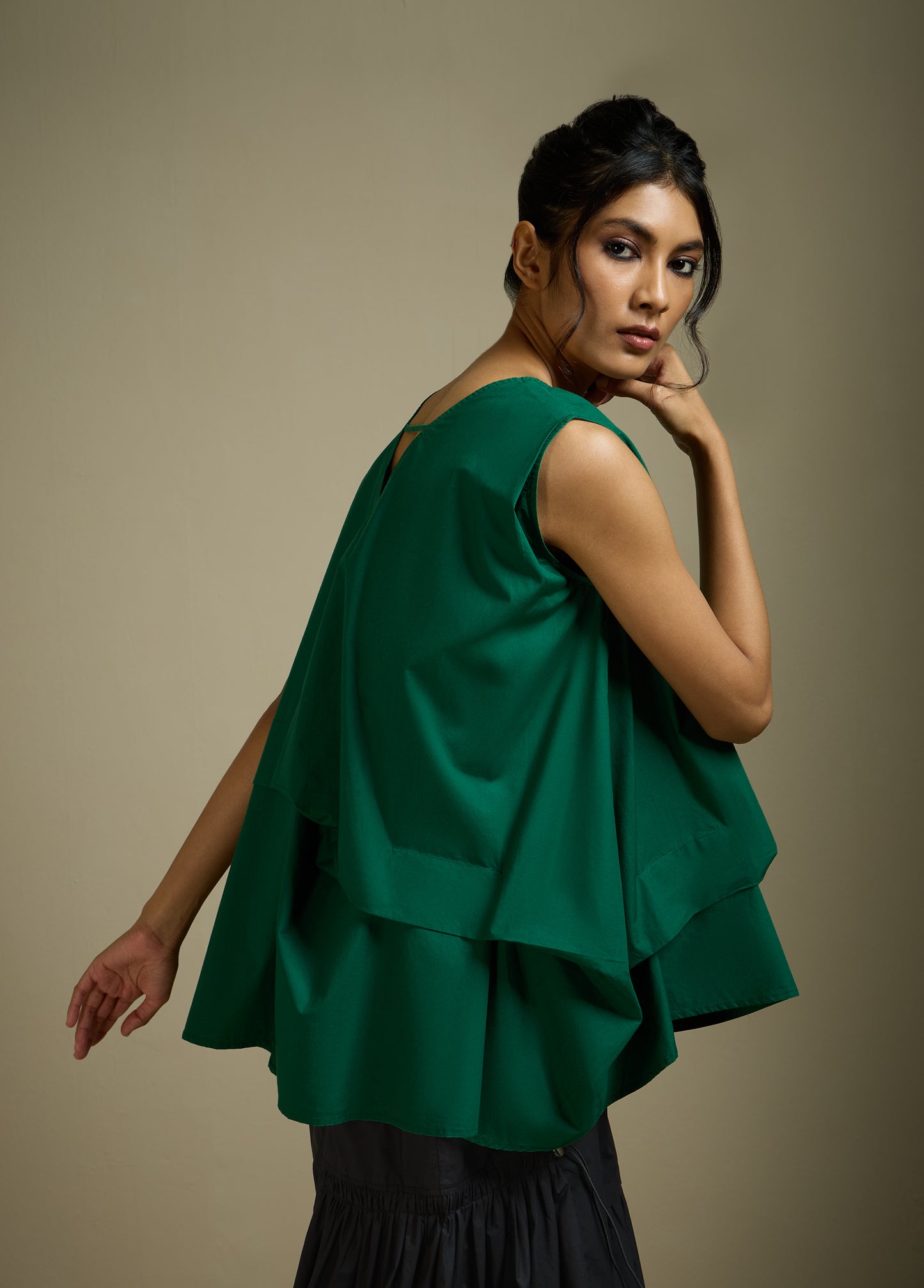 SLEEVELESS TOP WITH PANELLED DRAPE HEM