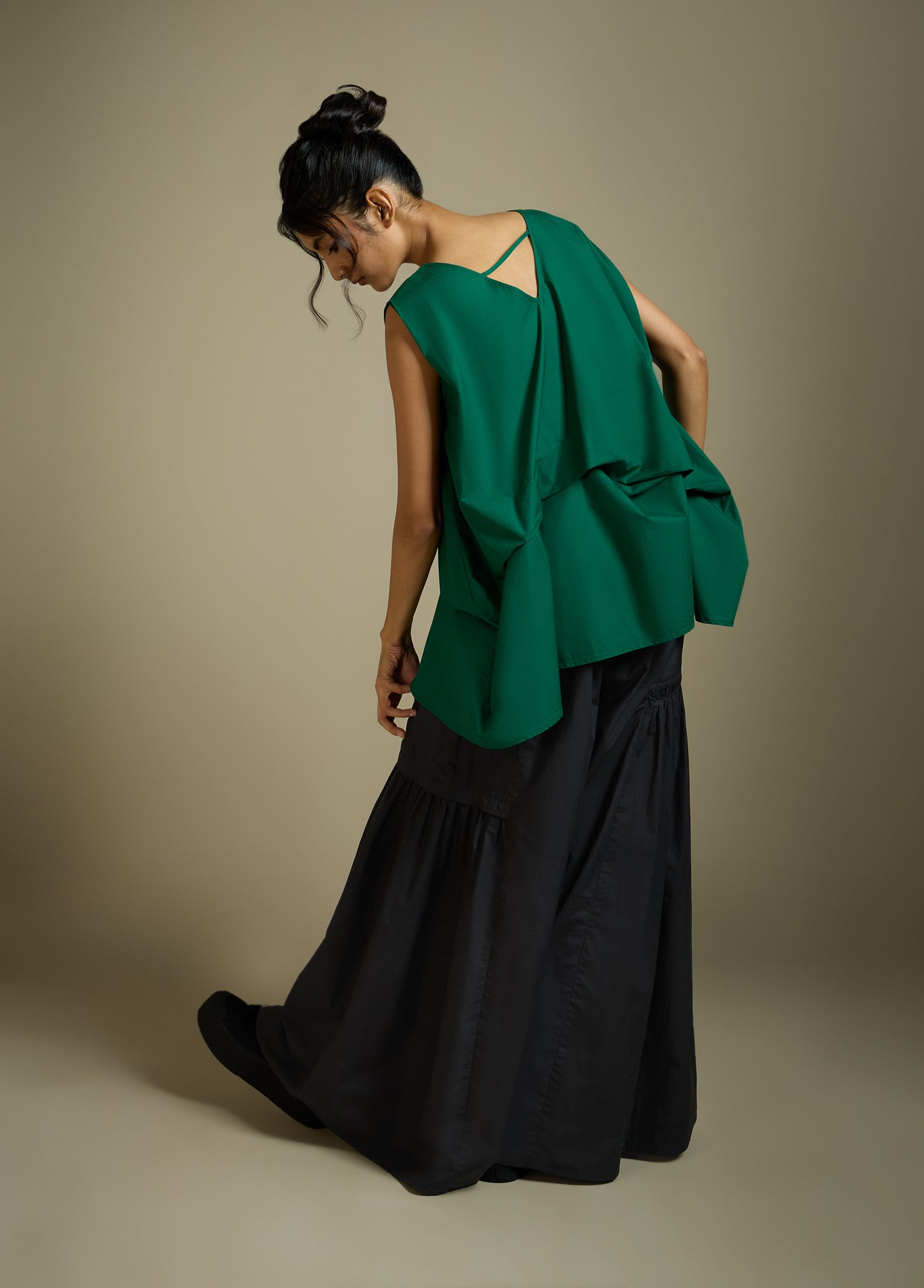 SLEEVELESS TOP WITH PANELLED DRAPE HEM