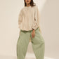 HIGH LOW TOP WITH FRONT PLEATS, CONSTRUCTED SLEEVE  AND HEM ELASTIC