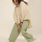 HIGH LOW TOP WITH FRONT PLEATS, CONSTRUCTED SLEEVE  AND HEM ELASTIC