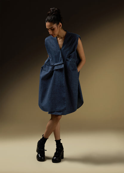 SLEEVELESS DRESS WITH ASYMMETRICAL FRONT PLEAT AND SHOULDER PADS