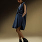 SLEEVELESS DRESS WITH ASYMMETRICAL FRONT PLEAT AND SHOULDER PADS