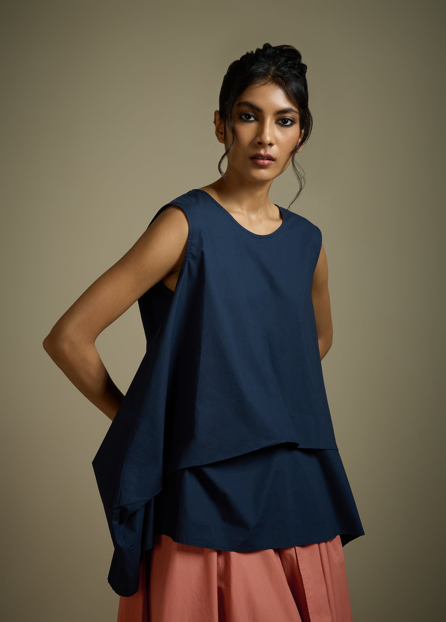 SLEEVELESS TOP WITH PANELLED DRAPE HEM