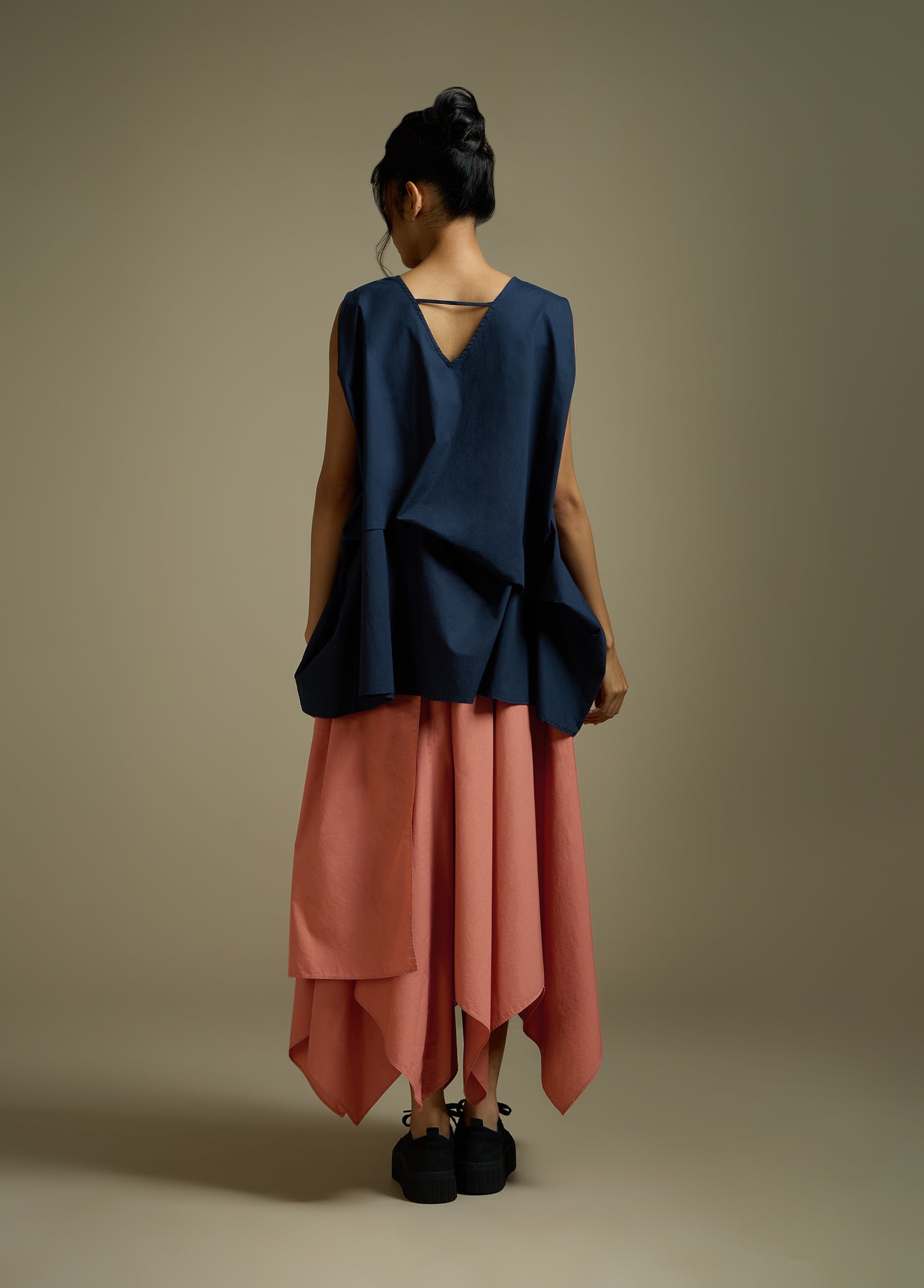 SLEEVELESS TOP WITH PANELLED DRAPE HEM