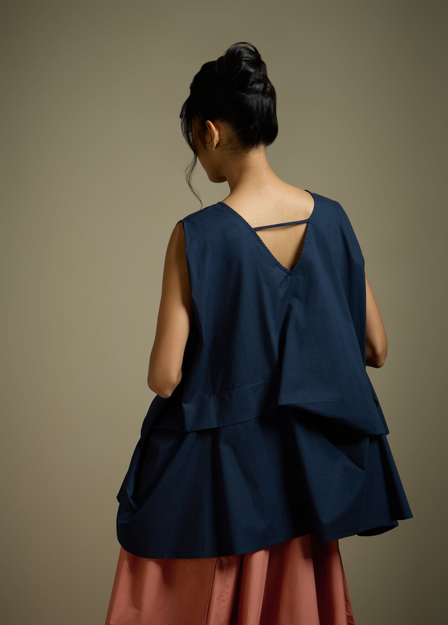 SLEEVELESS TOP WITH PANELLED DRAPE HEM