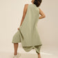 DRESS WITH FRONT PLEATS & DRAPE HEM