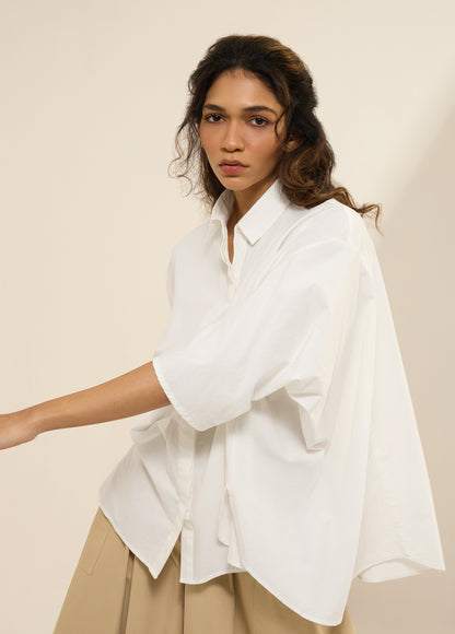 SHIRT WITH DECONSTRUCTED SLEEVES AND FLARE HEM