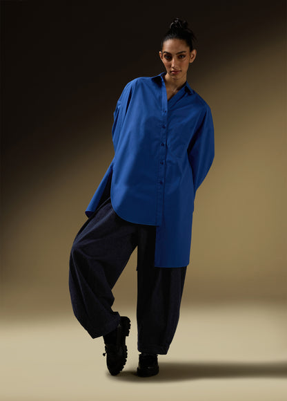 SHIRT WITH UNEVEN ASYMMETRICAL BUTTONTING AND BACK PLEATS