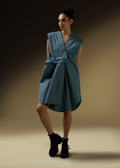 SLEEVELESS DRESS WITH ASYMMETRICAL FRONT PLEAT AND SHOULDER PADS