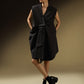 SLEEVELESS DRESS WITH ASYMMETRICAL FRONT PLEAT AND SHOULDER PADS