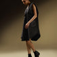 SLEEVELESS DRESS WITH ASYMMETRICAL FRONT PLEAT AND SHOULDER PADS