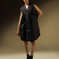 SLEEVELESS DRESS WITH ASYMMETRICAL FRONT PLEAT AND SHOULDER PADS
