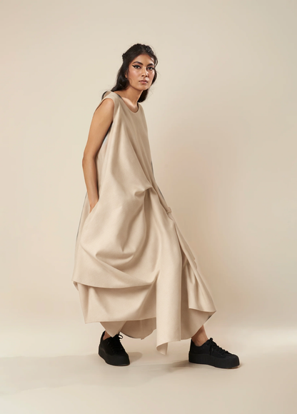 DRESS WITH DRAPE HEM AND STRAP DETAIL
