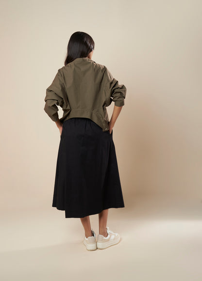 SKIRT WITH PLEATS AND PANELLED HEM