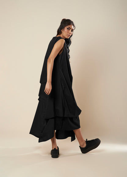 DRESS WITH DRAPE HEM AND STRAP DETAIL