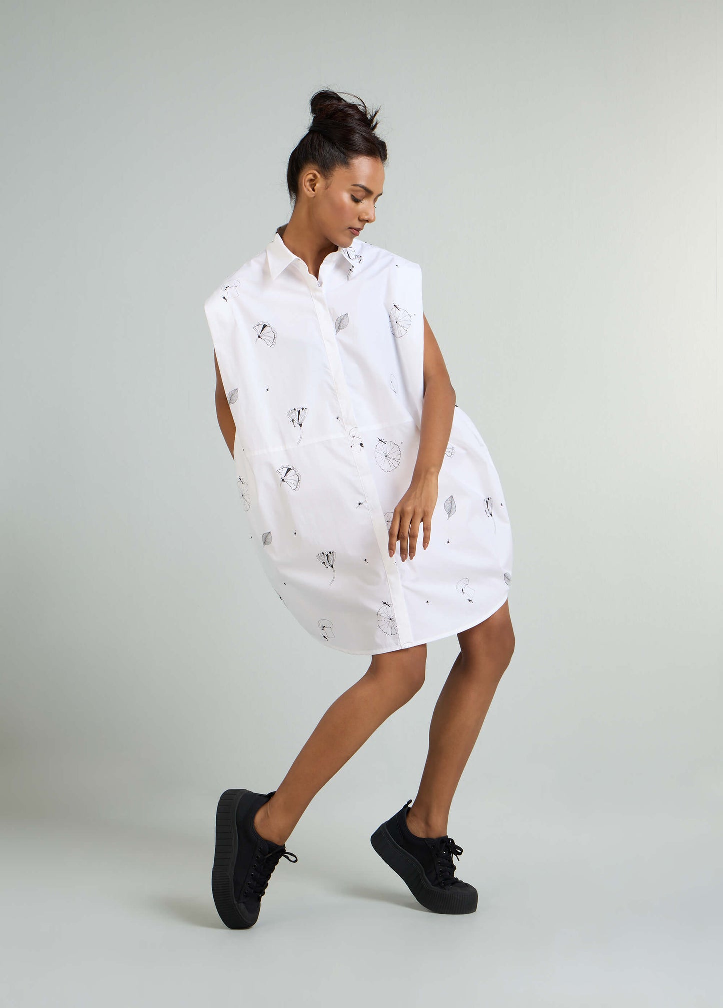 SLEVELESS DRESS WITH ROUNDED HEM AND SHOULDER PANEL