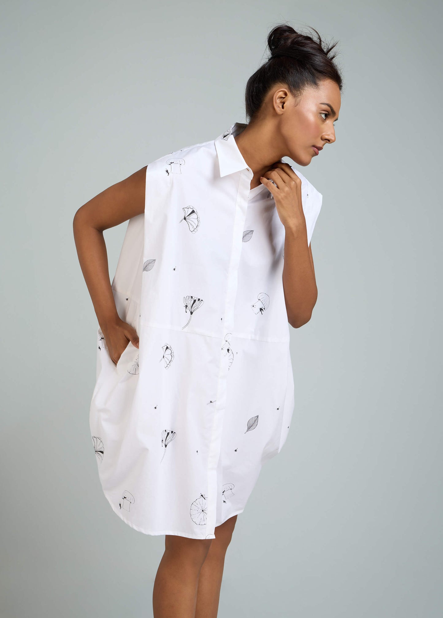 SLEVELESS DRESS WITH ROUNDED HEM AND SHOULDER PANEL