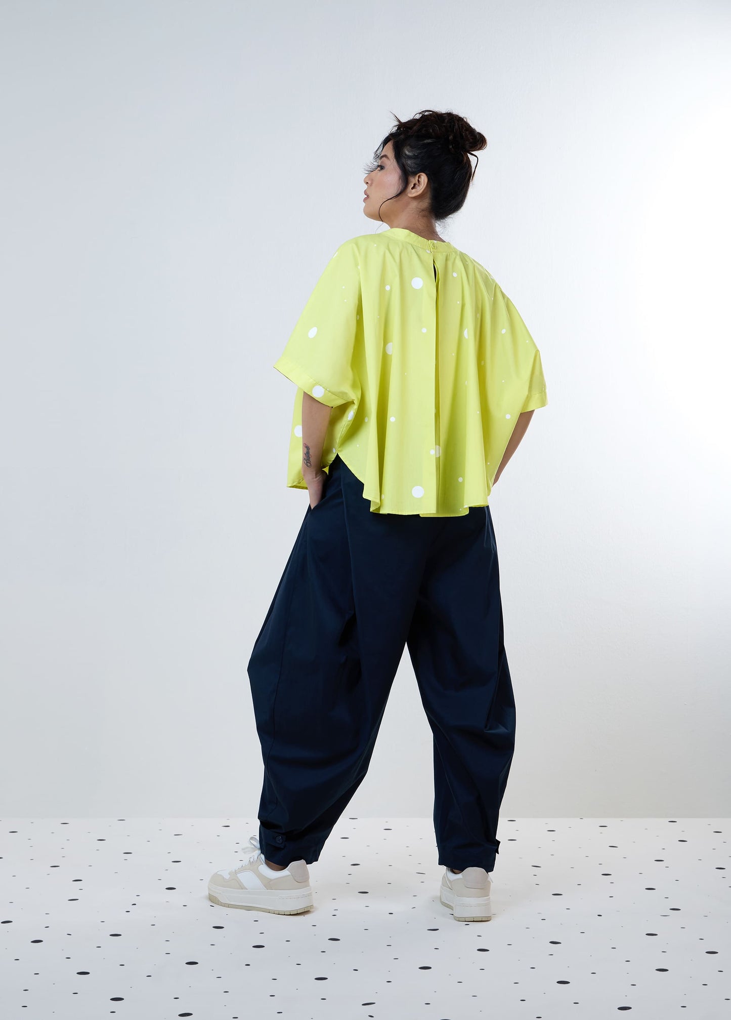 PANTS WITH CONSTRUCTED SIDE PLEAT
